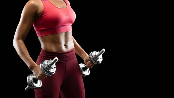 Close up of sporty woman with good body holding dumbbells — 스톡 사진