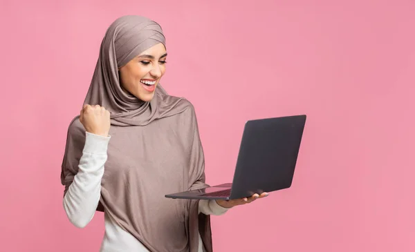 Euphoric Arabic Girl In Hijab Celebrating Success with Laptop — Stok Foto