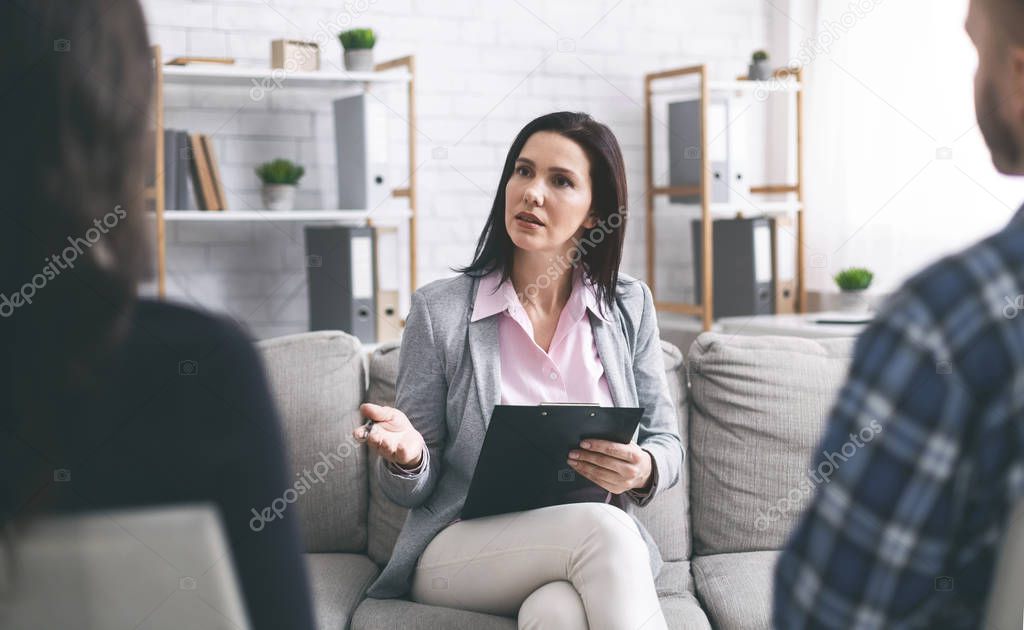 Therapist talking with married patients at private consultation