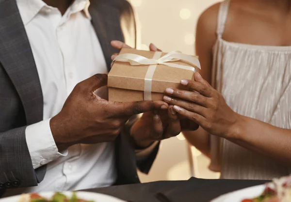 Cropped of man and woman holding gift box — 스톡 사진