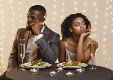Lovers being unhappy because of troubled date clipart