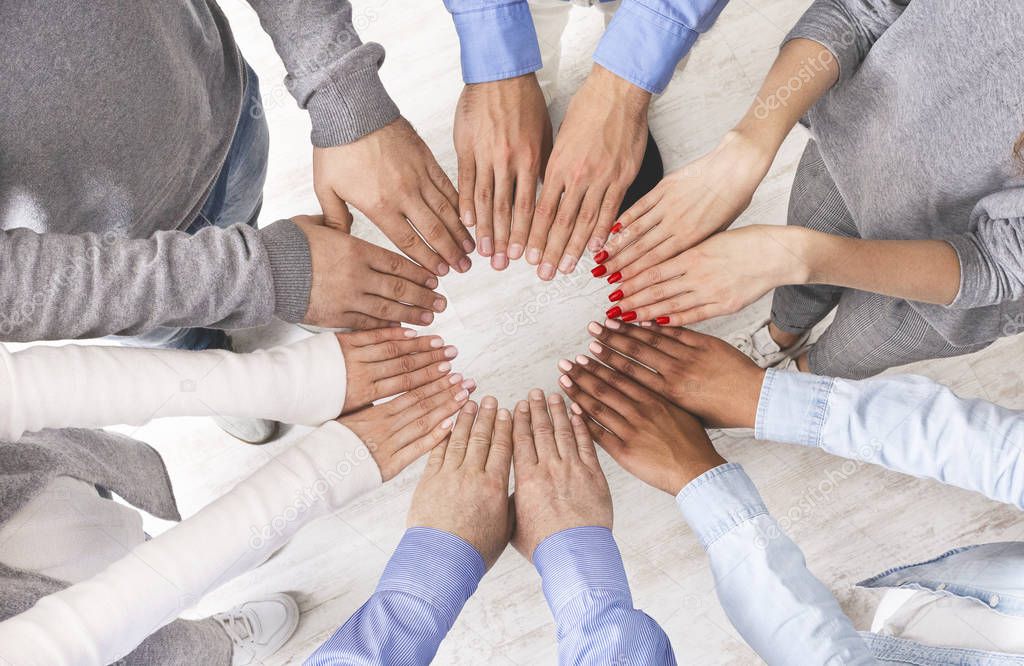 Multiethnic Group Of People Making Circle Of Their Hands, Top View