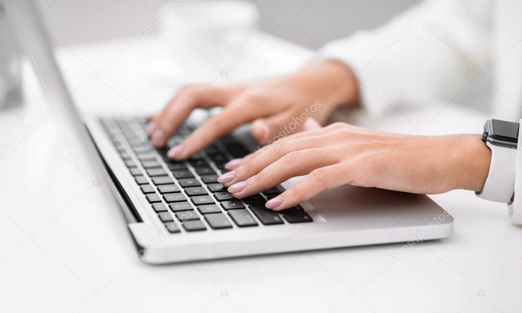 Cropped image of manager using her laptop computer