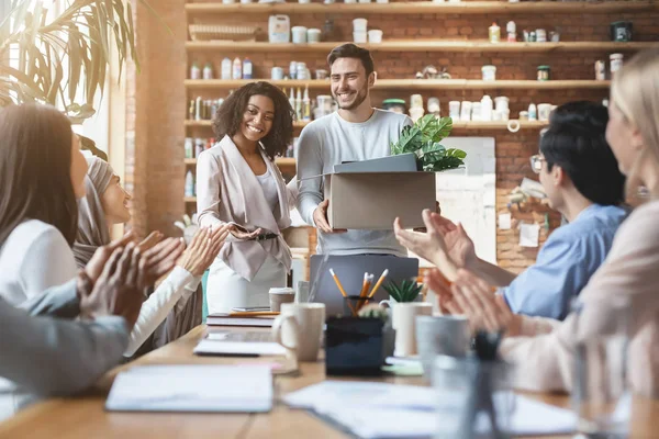 Young multiracial team welcoming cheerful guy newcomer — Stock Photo, Image