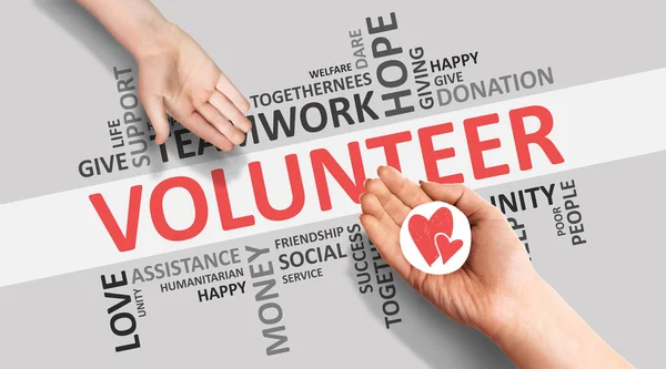 Hands Giving Picture Of Heart On Volunteer Wordcloud Background, Panorama — Stock Photo, Image