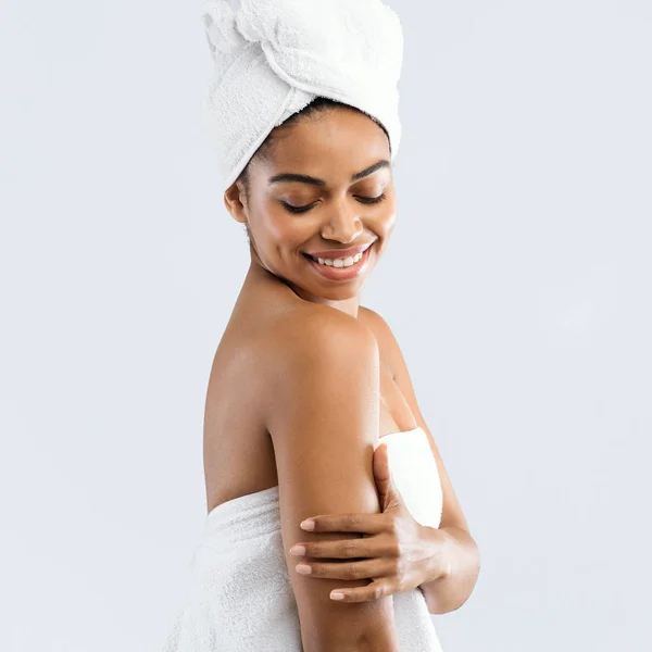 Portrait of cheerful girl enjoying her silky skin after spa — 스톡 사진