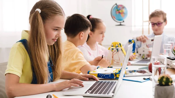 Girl watching scientific robotics video at lesson — Stock Photo, Image