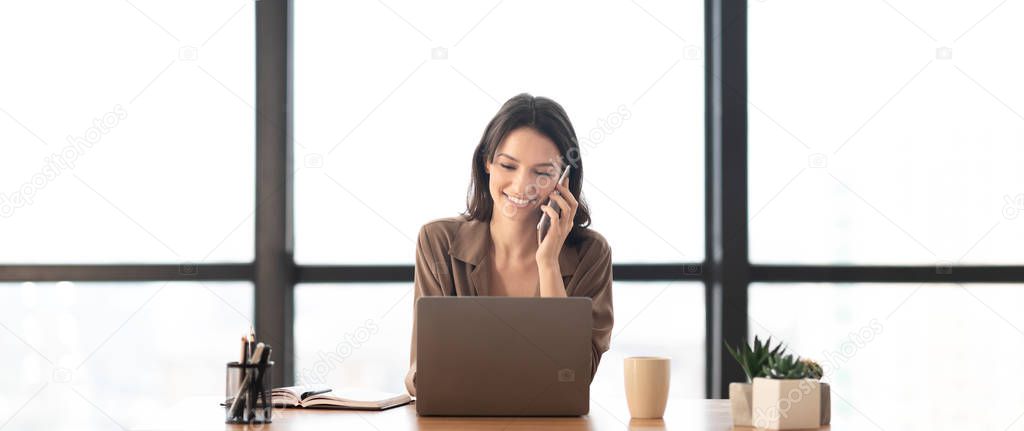 Portrait of smiling manager making phone call