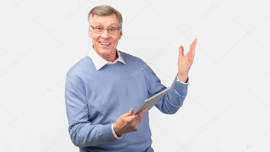 Excited Elderly Gentleman Using Tablet Standing Over Gray Background, Panorama