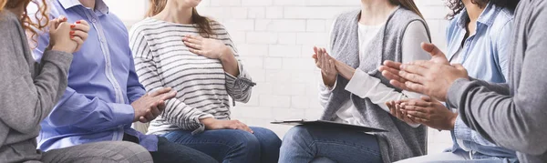 Group of unrecognizable people applauding to woman at psychotherapy session — Stok fotoğraf