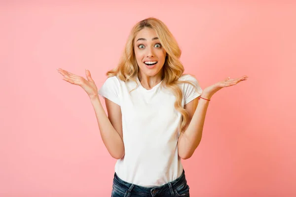 Joy. Surprised woman raising hands and looking at camera — Stock Photo, Image