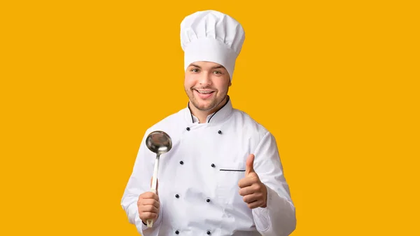 Male Chef Gesturing Thumbs-Up Posing Holding Ladle Spoon, Panorama, Studio — Stock Photo, Image