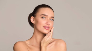 Personal care concept. Woman touching soft skin