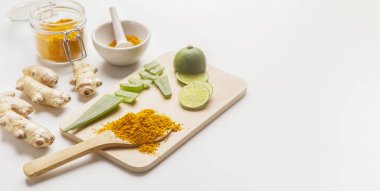 Homemade scrub curcumin powder, honey and turmeric roots