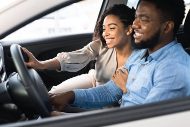 Joyful Spouses Testing New Car Sitting In Auto In Store
