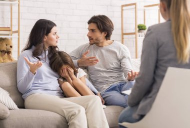 Little Girl Crying While Her Parents Argue At Counsellors Office
