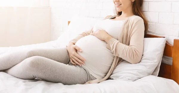 Calm pregnant woman touching her belly, panorama — Stock Photo, Image