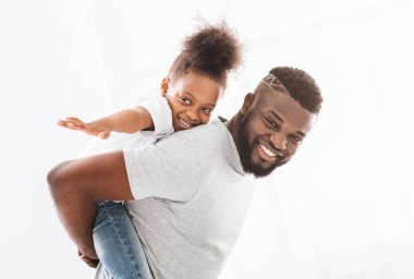 Portrait of happy black family having fun over white backgroud