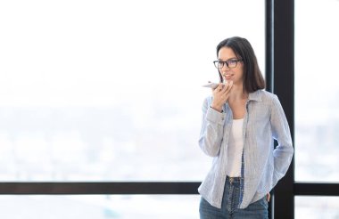 Business girl using mobile voice recognition function