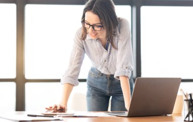 Caucasian woman using tablet that lying on the table