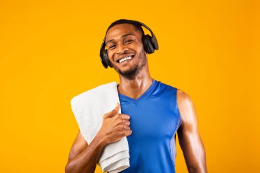 Portrait of handsome black man with headset and towel