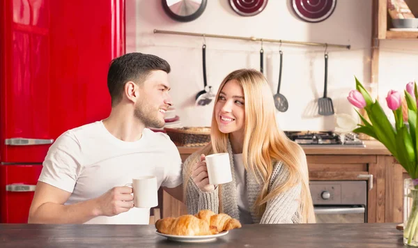Couple in love having tasty breakfast with butter croissants — Stok fotoğraf