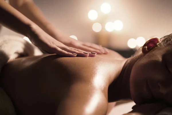 Woman getting massaging treatment in luxury spa — 图库照片