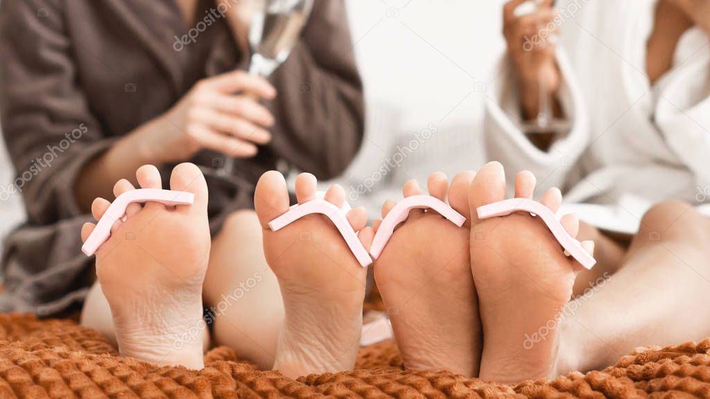 Close up of women feet with toe separators on