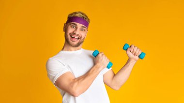 Ridiculous guy lifts dumbbells doing morning exercises
