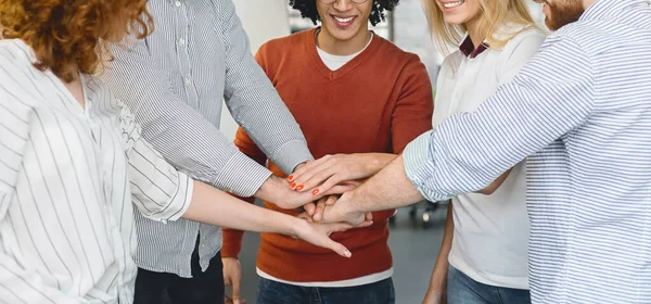 Close up of coworkers team uniting hands together — Stok fotoğraf