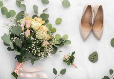 Wedding accessories in bride and groom room on white