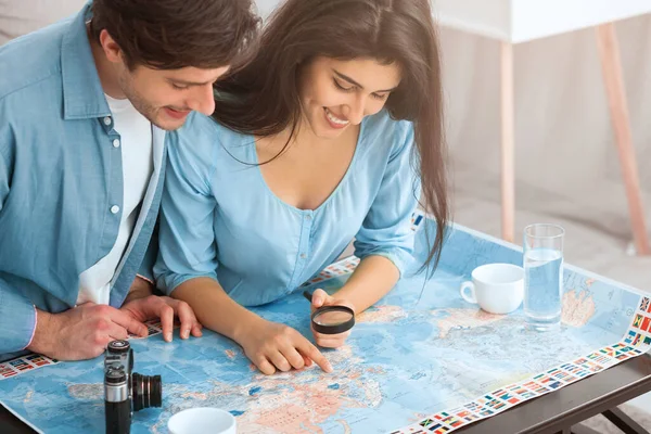 Preparation for vacation. Couple planning travel and looking map — Stock Fotó