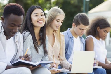 Intelligent international students preparing for final exams