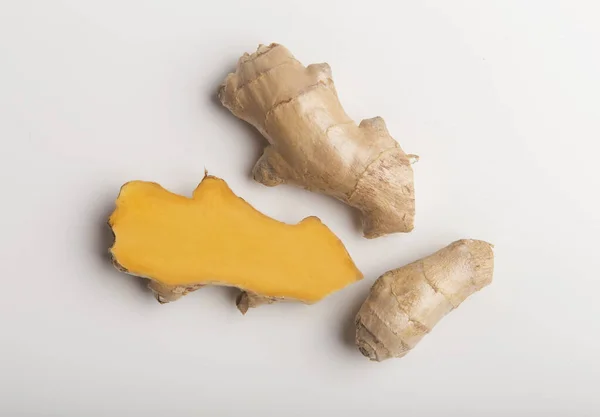 Turmeric root on white background used as a tonic for body — Stok fotoğraf