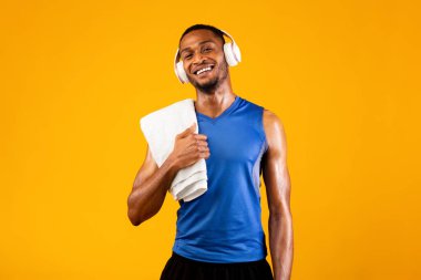 Handsome black man with headset and towel