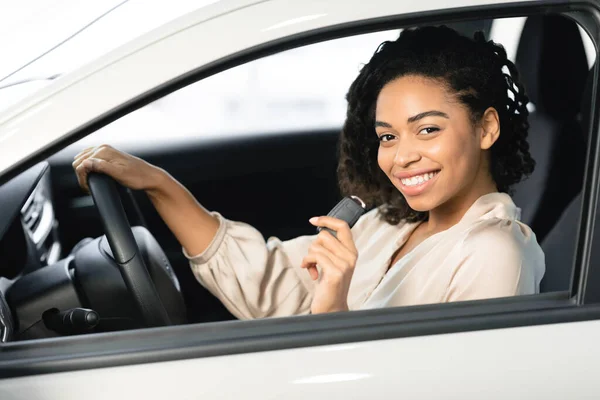 Joyful Woman Showing Key Sitting In Drivers Seat In Automobile — 스톡 사진