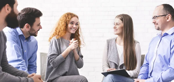 Addicted woman sharing her rehabilitation success with group at therapy session — Stock Photo, Image