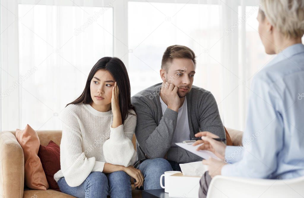 Spouses After Family Conflict Sitting In Psychologists Office
