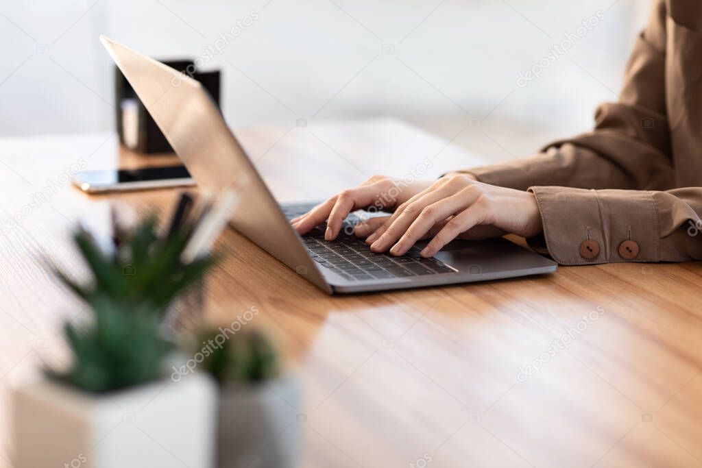 Woman using her personal computer at home office