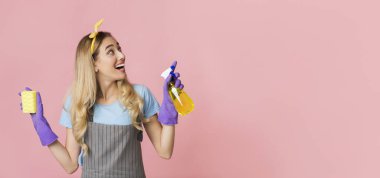 Funny girl spraying and looking at empty place