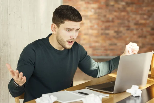 Emotional Worker Looking At Laptop Having Problem Sitting In Office — Stockfoto