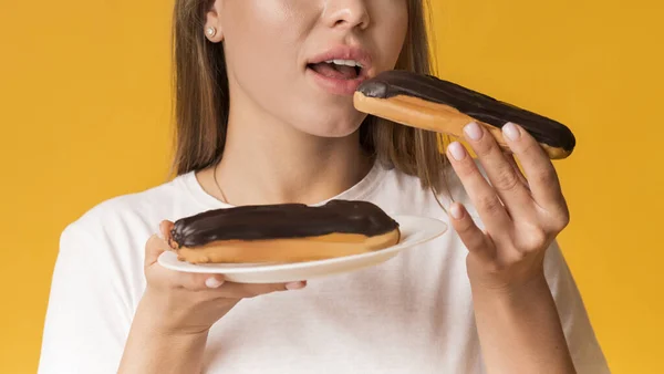 Unrecognizable Girl Eating Tasty Eclairs With Chocolate Cream, Enjoying Unhealthy Sweets — Stok fotoğraf