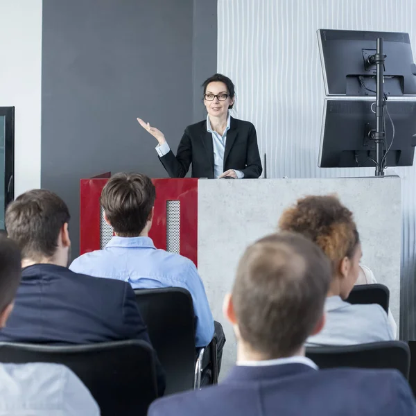 Confident CEO giving presentation to young staff — Stockfoto