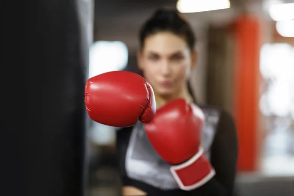 Personal defense class. Young female sportsman in gym, focus on boxing glove — Φωτογραφία Αρχείου