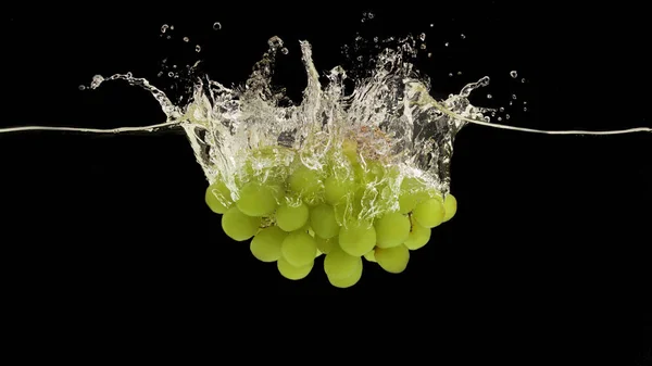 Juicy green grapes splashing into fresh water on black background, panorama — 스톡 사진