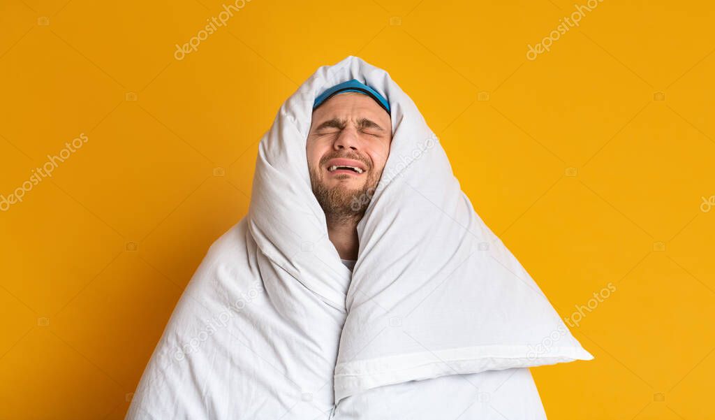 Doesnt want get up. Funny man wrapped in blanket