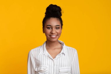 Portrait of smiling young african american woman looking at camera