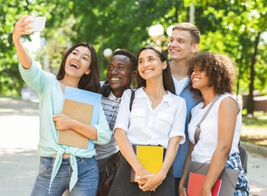 Cheerful Asian Student Girl Taking Selfie With Her University Friends