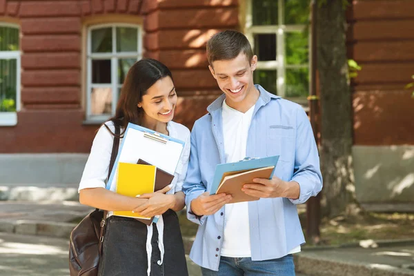 Happy University Friends Standing Outdoors In Campus, Checking Test Results — Stockfoto