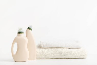 Softener and whitening washing detergents with blank space on bottles